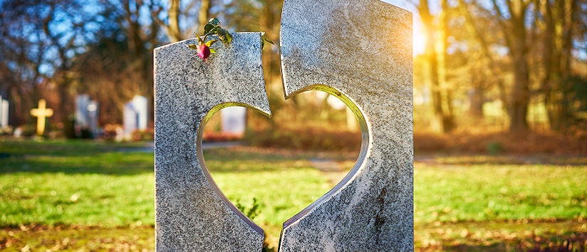 Grave stone with heart carved in the middle