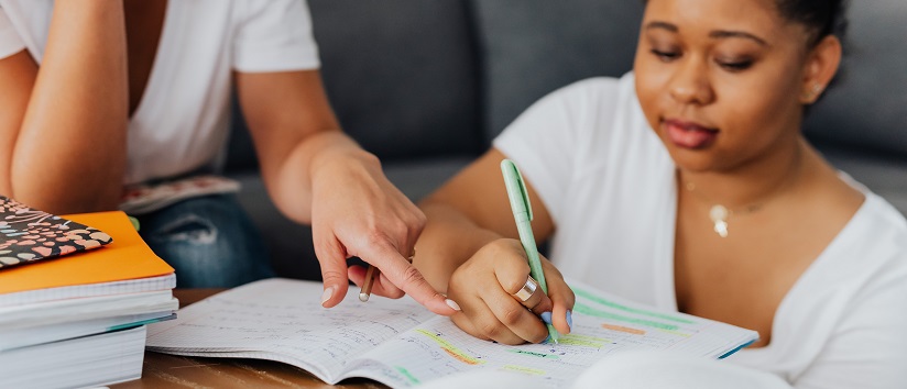 woman tutoring girl, homework