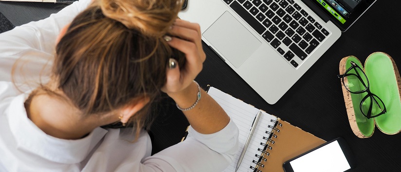 Stressed woman working at computer